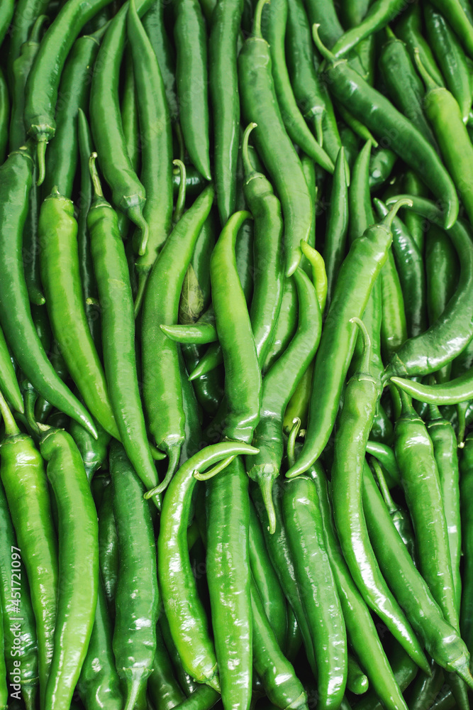 Green chili peppers. Background, food texture, new harvest. Green chili peppers. Background, food texture, new harvest.