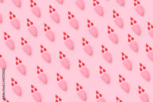Many menstrual cups on color background photo