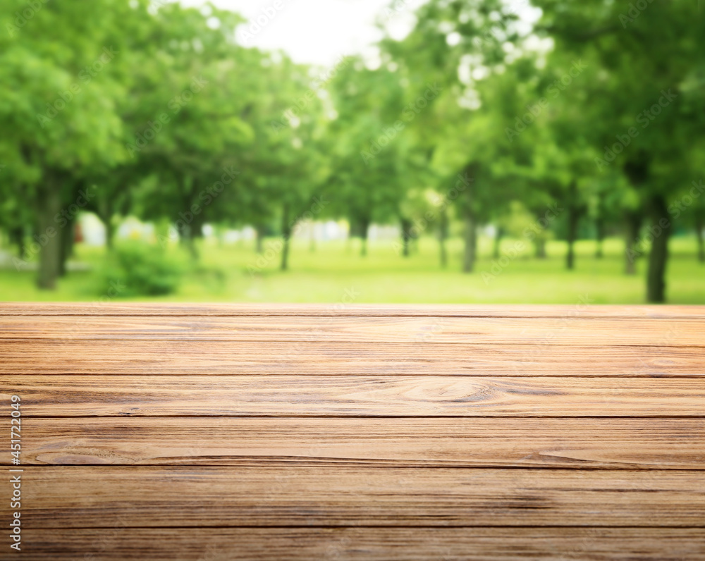 Empty wooden table in park Empty wooden table in park