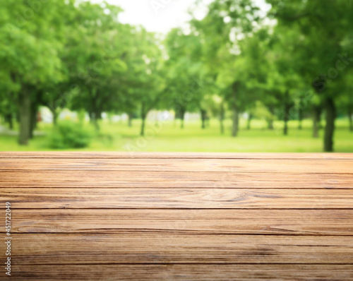 Empty wooden table in park