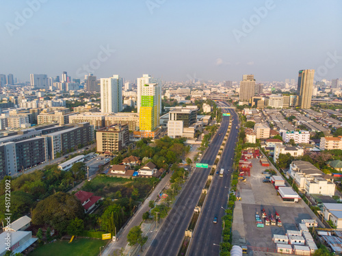 Aerial view morning sunrise city building with transport road © themorningglory