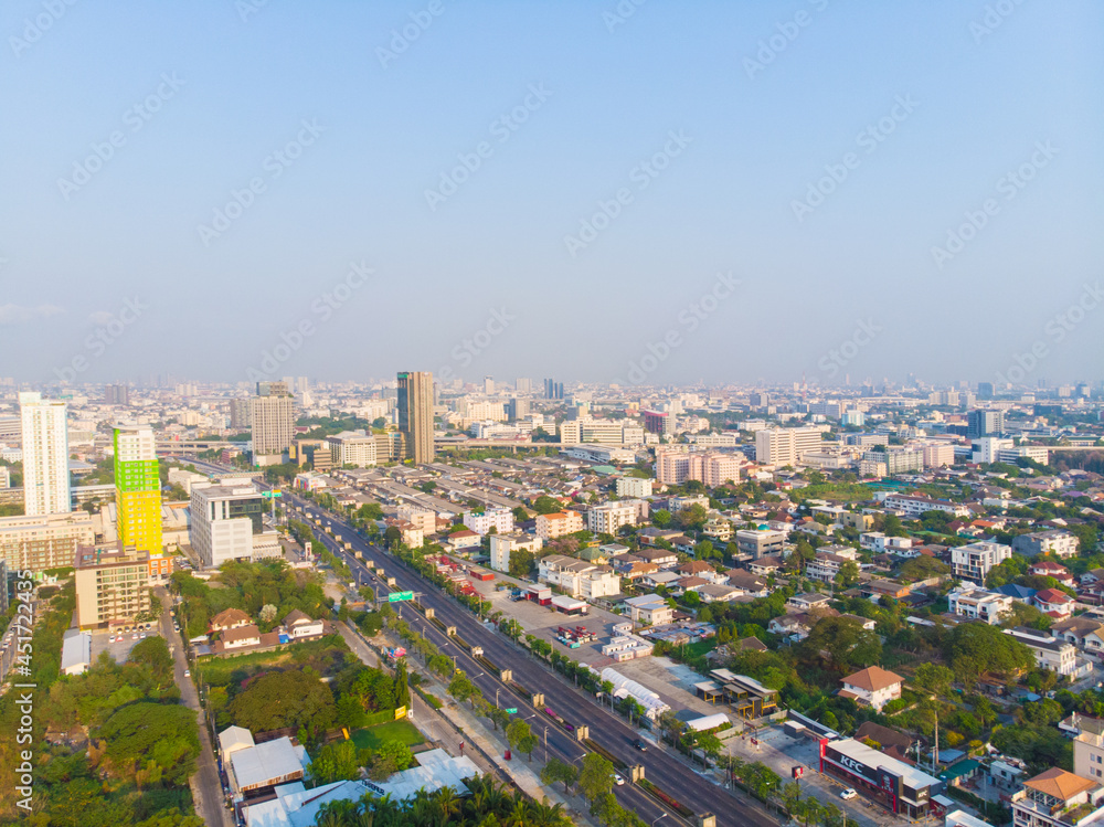 Fototapeta premium Aerial view morning sunrise city building with transport road
