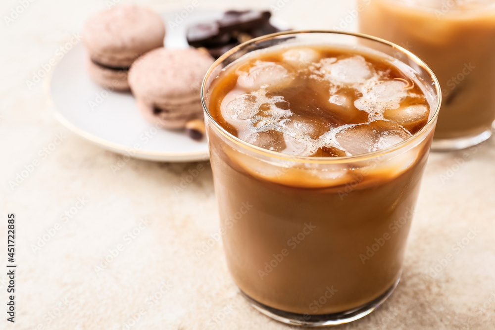 Glass of tasty iced coffee on table, closeup Glass of tasty iced coffee on table, closeup