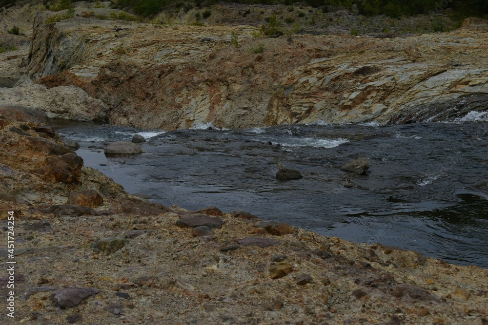 The natural water flowing river along with the rough rock mountain in Sapporo Japan