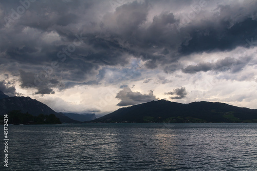 Lake attersee at storm cloudy sky with alps mountain. Moody weather, Austria, salzburg region. © Space Creator