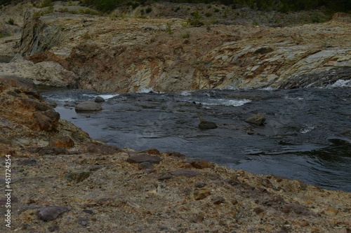 The natural water flowing river along with the rough rock mountain in Sapporo Japan