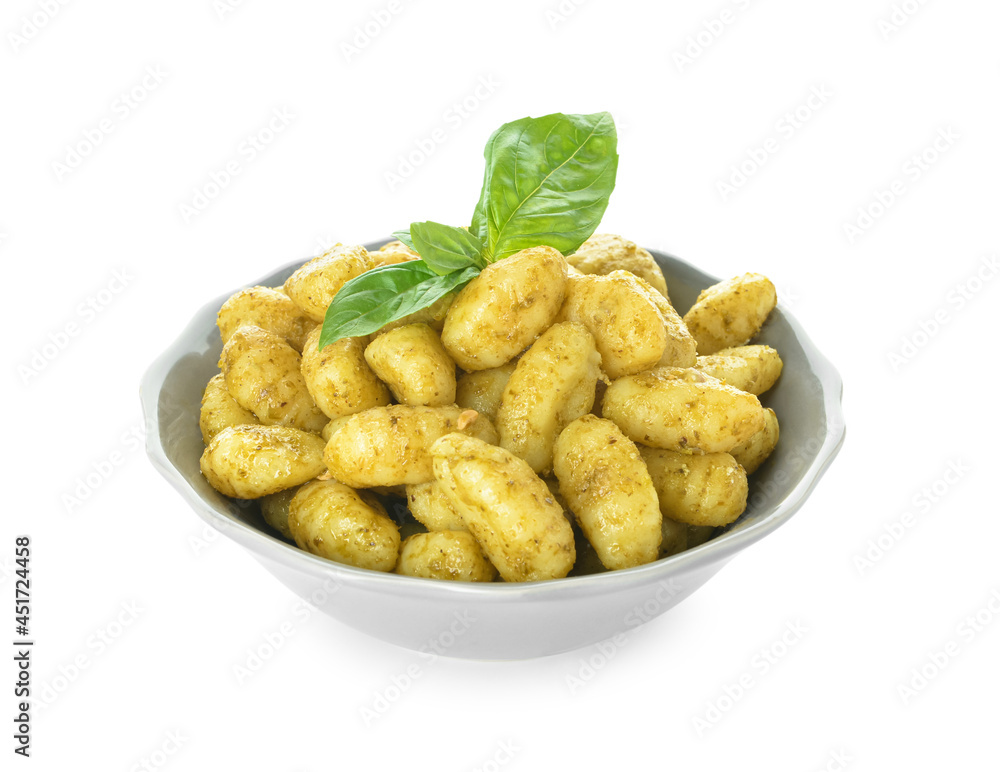 Bowl with tasty pesto gnocchi on white background Bowl with tasty pesto gnocchi on white background