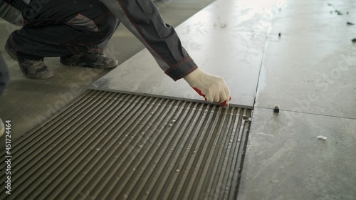 фотографія Installing a large ceramic tile