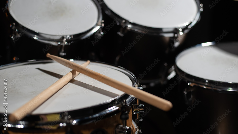 Close-up of drumsticks on a cymbal drum Close-up of drumsticks on a cymbal drum