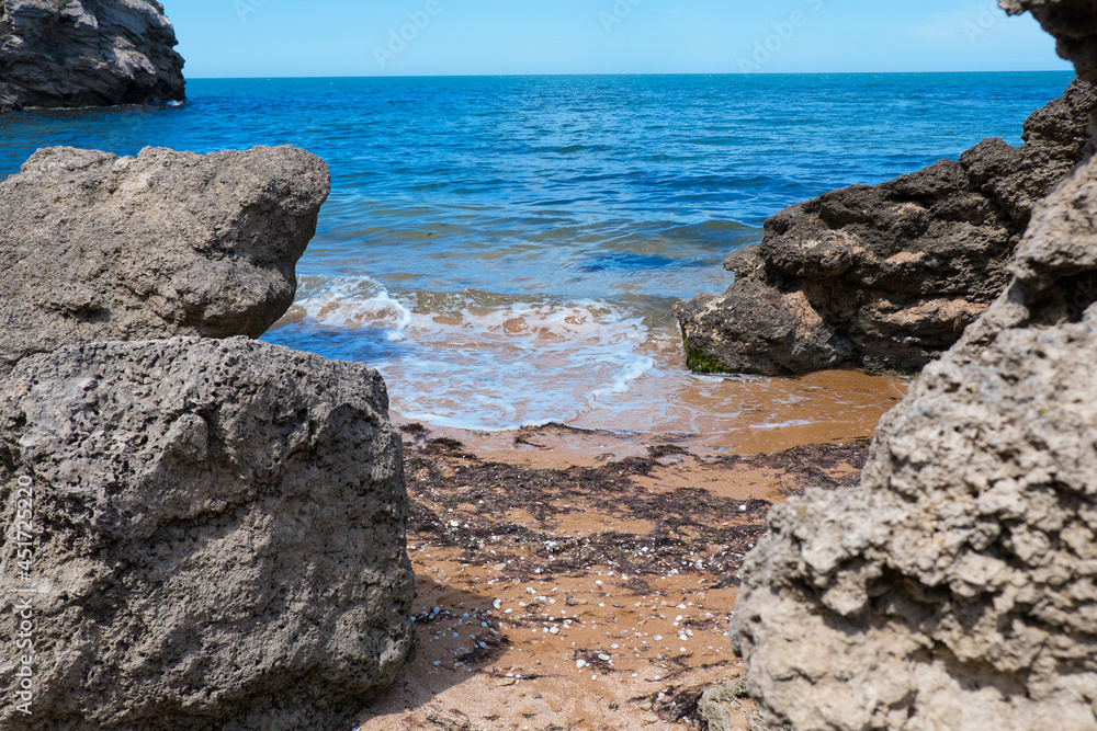the concept of boating, recreation, travel - splashes of blue water in the rsea, ocean, mountains, sky, stone shore. Copy space the concept of boating, recreation, travel - splashes of blue water in the rsea, ocean, mountains, sky, stone shore. Copy space