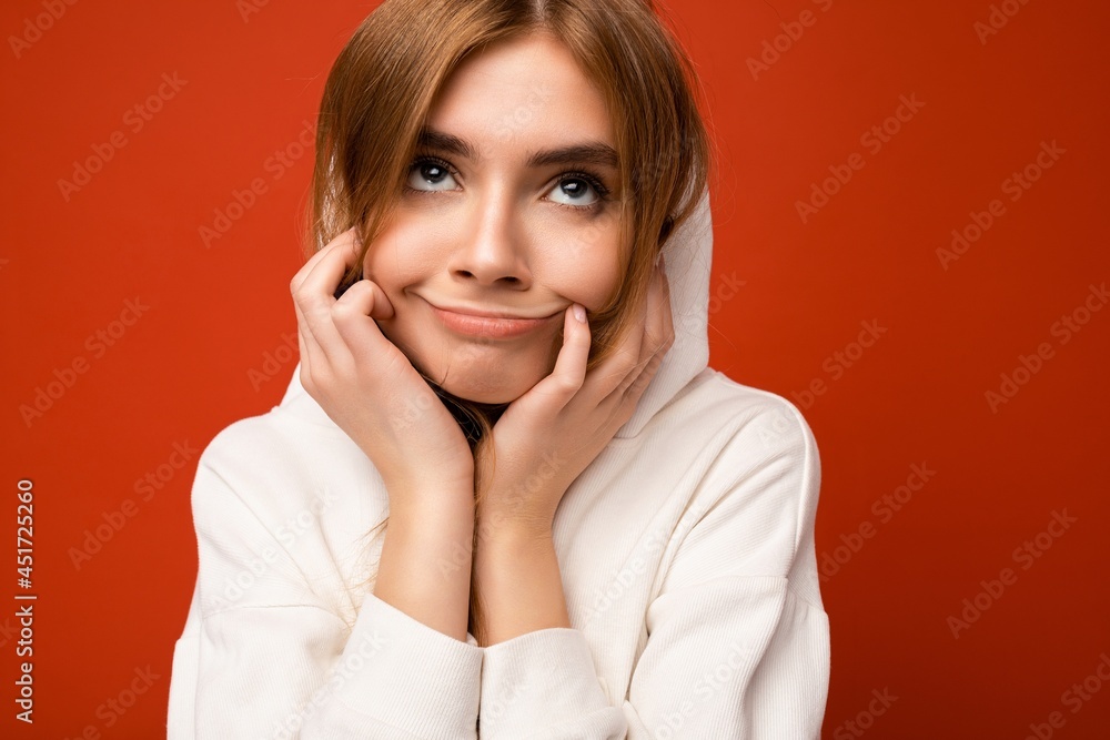 Young tired amusing beautiful dark blonde woman with sincere emotions isolated on background wall with copy space wearing casual white hoodie. Emotional concept Young tired amusing beautiful dark blonde woman with sincere emotions isolated on background wall with copy space wearing casual white hoodie. Emotional concept