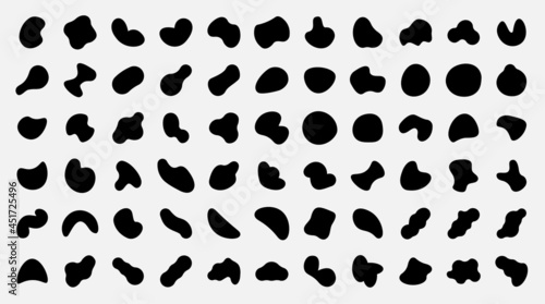 Organic shapes. Black abstract irregular oval and round spots. Pebble silhouettes and fluid splodge. Isolated graphic paint blots collection. Vector ink stains and random stones set