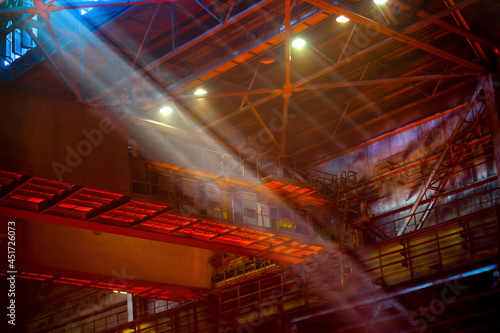 Metallurgical plant. Beams of soft diffused daylight and electric light inside the hot-rolled steel workshop. Foundry of heavy industry. Industrial steel production. © Евгений Панов