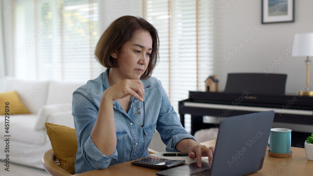 Asia adult upset sad people or pensive SME owner latin lady sit at home brownout work on desk laptop tired bored pain in mental health care issue, job loss life crisis or think hard of debt loan. Asia adult upset sad people or pensive SME owner latin lady sit at home brownout work on desk laptop tired bored pain in mental health care issue, job loss life crisis or think hard of debt loan.