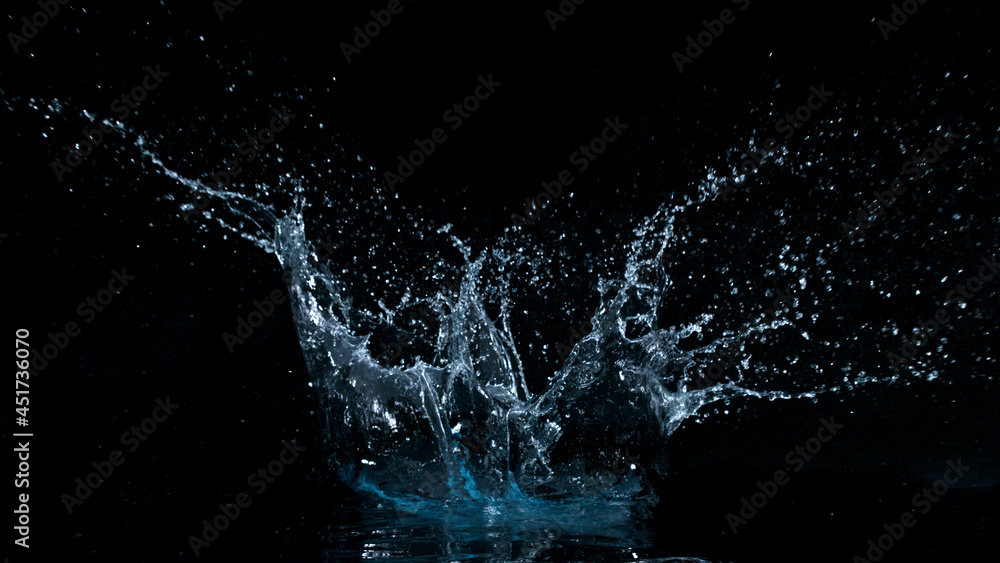 Obraz premium Freeze motion of water splash isolated on black background.
