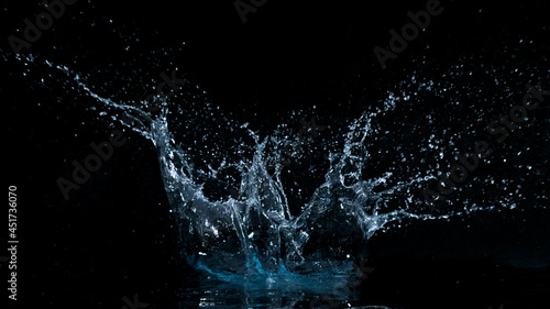 Freeze motion of water splash isolated on black background. © Lukas Gojda