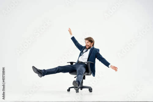 business man rolling in a chair entertainment work office