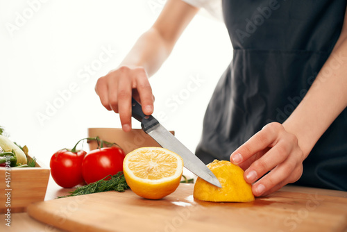 Cutting board lemon vitamins salad preparation kitchen