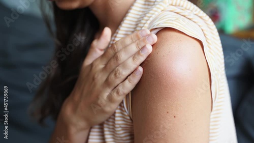 Side effect of the vaccine - shoulder skin redness and pain. Covid-19 vaccination reaction. Woman skin itchy and swelling after vaccine shot