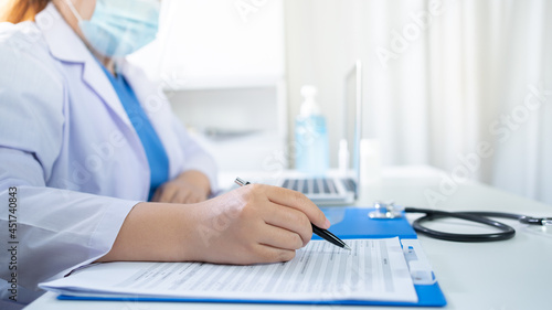 Education profession doctor in white uniform gown coat. Professional medical doctor with tablet and papers at seminar or hospital Coronavirus cancer healthcare