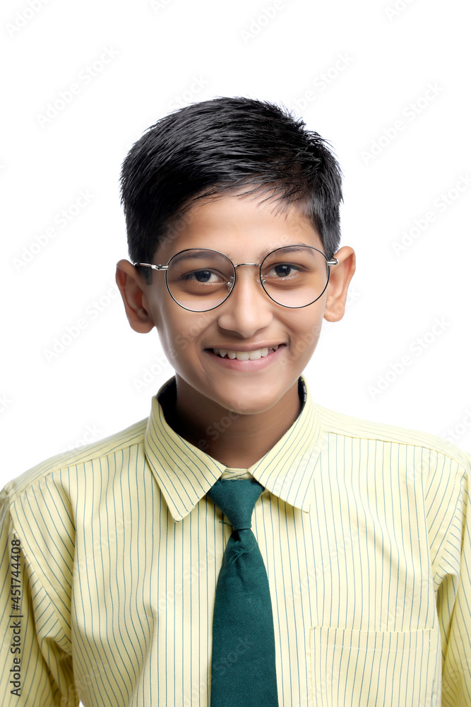 Indian child in school uniform on white background. Indian child in school uniform on white background.