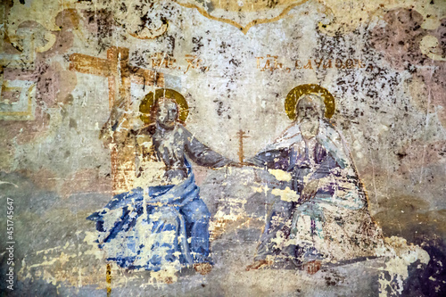 illustrations from the bible on the wall of an abandoned temple