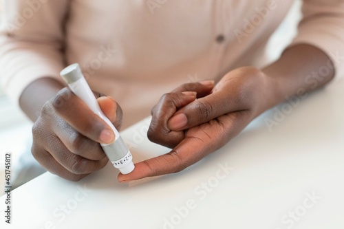 Taking finger prick blood sample