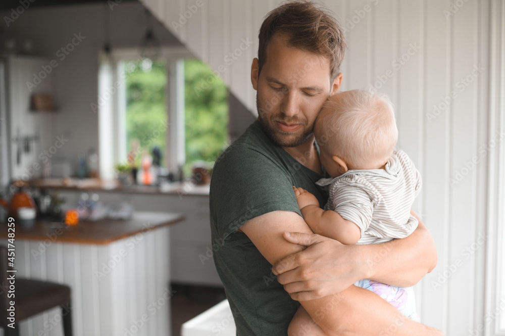 portrait of attractive nerd with glasses at home playing with a son. Cute baby boy. Happy fatherhood portrait of attractive nerd with glasses at home playing with a son. Cute baby boy. Happy fatherhood