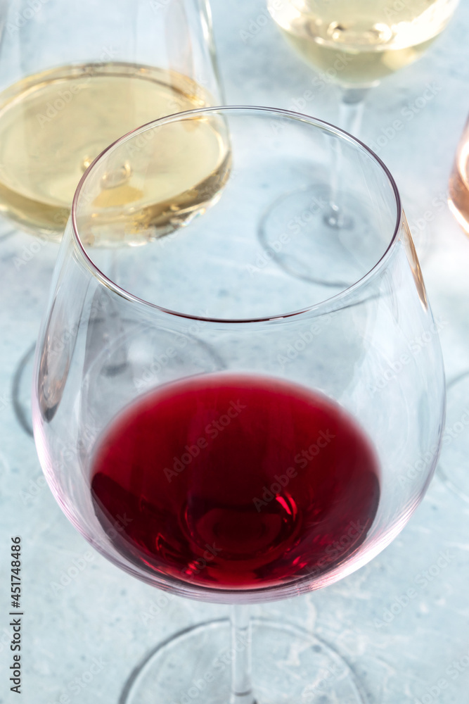 Red and white wine in different glasses at a wine tasting. Close-up shot Red and white wine in different glasses at a wine tasting. Close-up shot