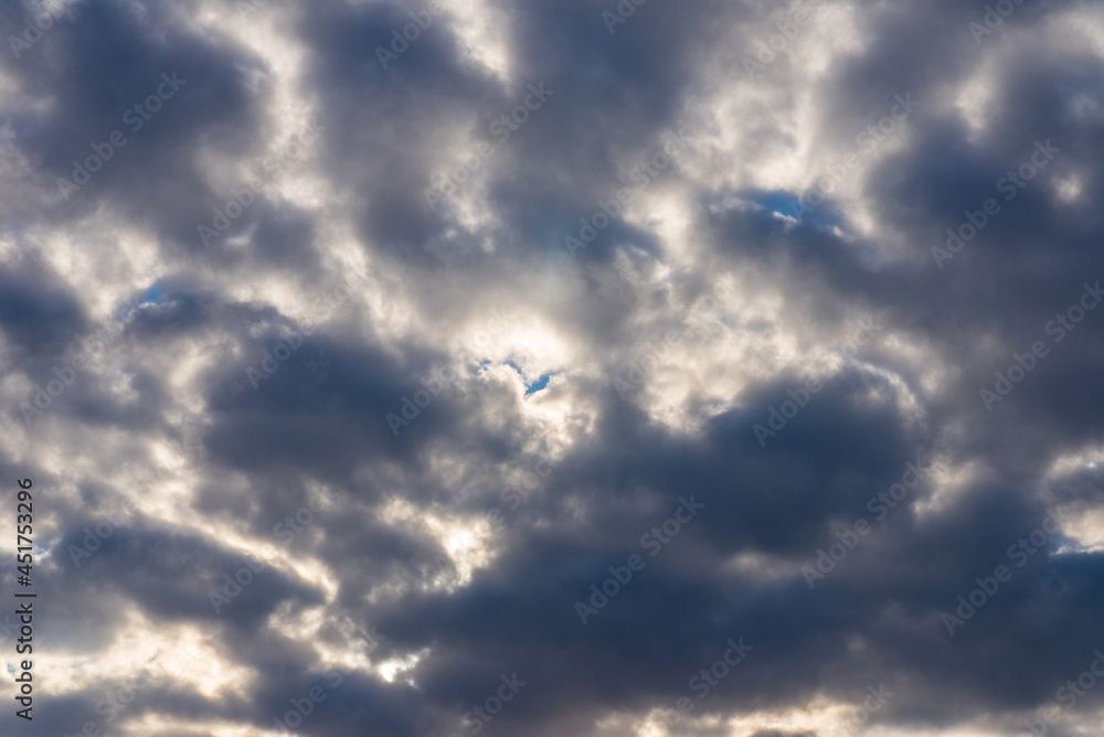 Rays of light shining throug dark clouds.Beautiful dramatic sky with sun rays. Rays of light shining throug dark clouds.Beautiful dramatic sky with sun rays.