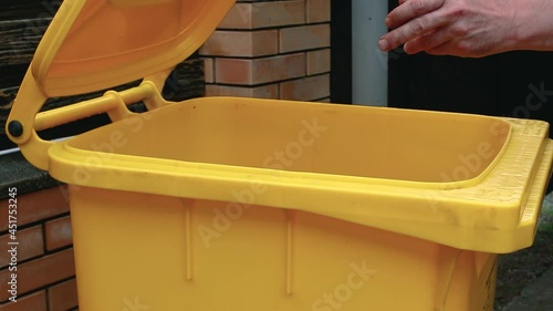 Throwing the plastic bottle into the trash can. Sorting non-degradable waste garbage. Recycling. Ecology.