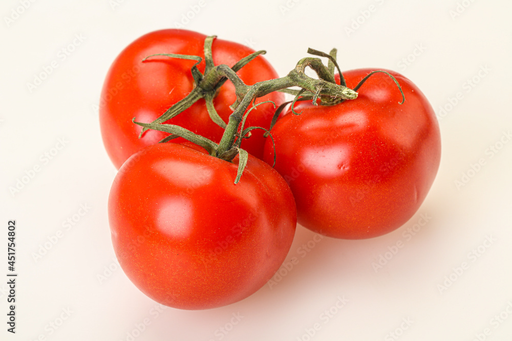 Red bright ripe tomato branch