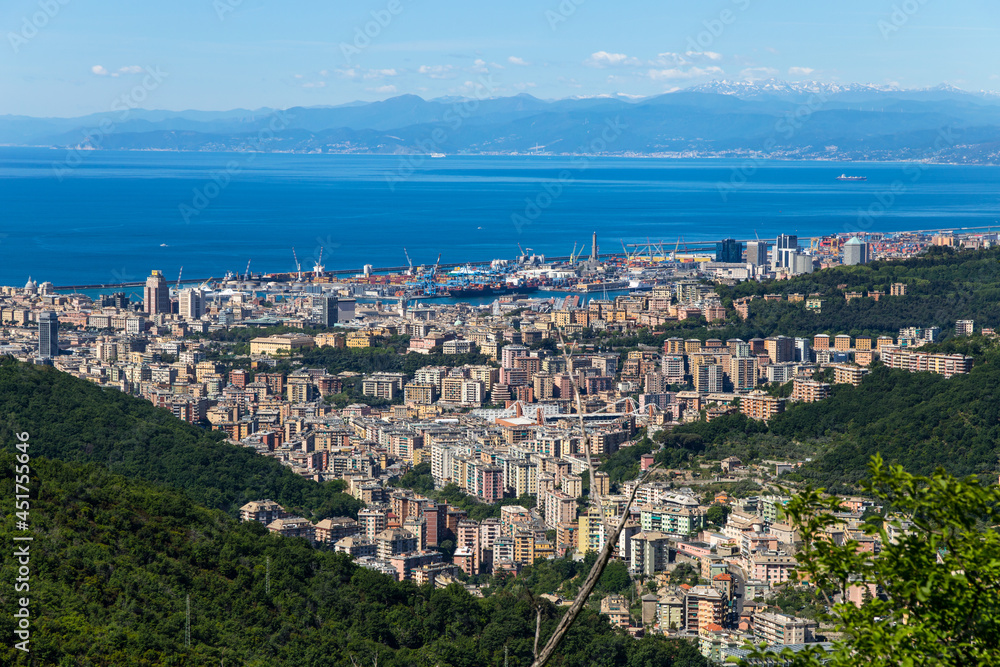 Overview of the city of Genoa and its port in a sunny day, Italy.