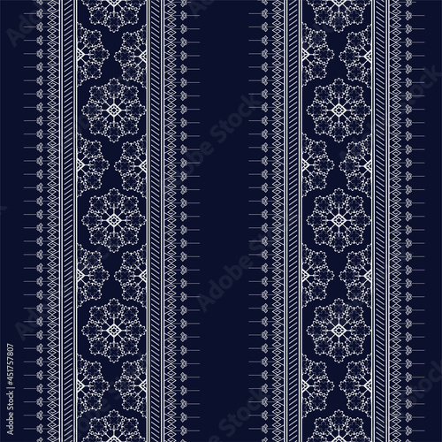 Geometric ethnic texture embroidery with Dark Blue background, wallpaper,skirt,carpet,wallpaper,clothing,wrapping,Batik,fabric,sheet, texture Flowers pattern in Vector, illustration style.eps