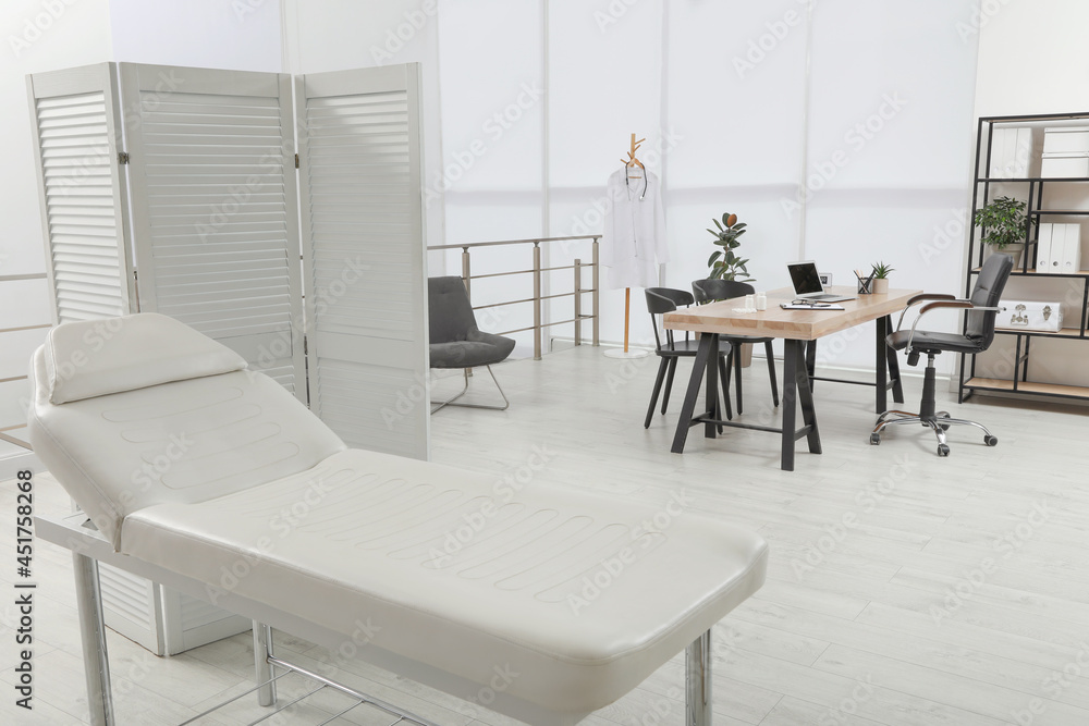 Modern medical office interior with couch. Doctor's workplace Modern medical office interior with couch. Doctor's workplace