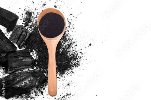 charcoal and charcoal powder on wooden spoon. Skin care,Health care,body wash gel beauty concept.Isolate on White background with clipping mask path. Above top view. photo