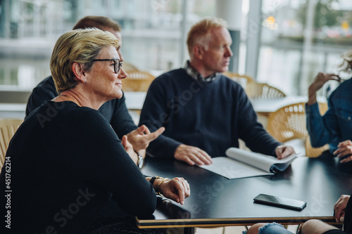 фотографія Senior businesswoman in a boardroom meeting