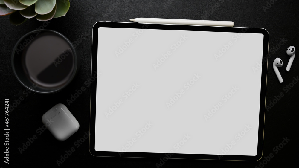 digital tablet computer blank screen mockup on black background, wireless device on black surface digital tablet computer blank screen mockup on black background, wireless device on black surface
