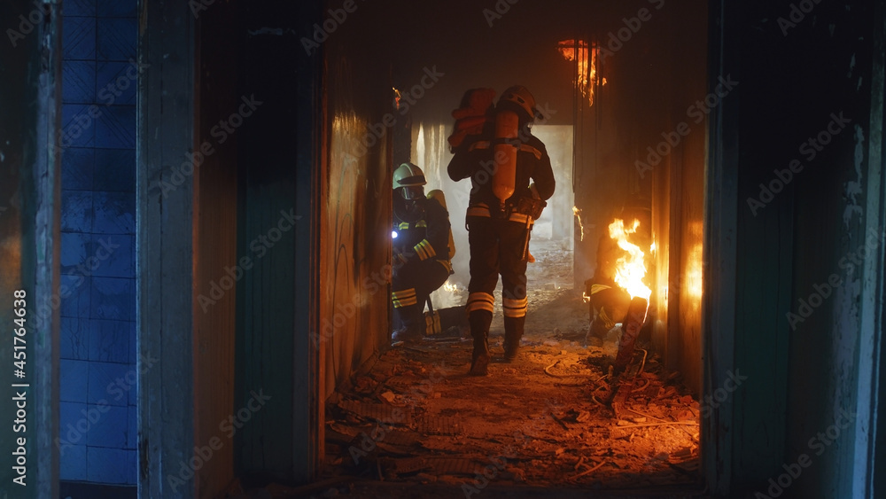Firemen running through fire and looking for survivors