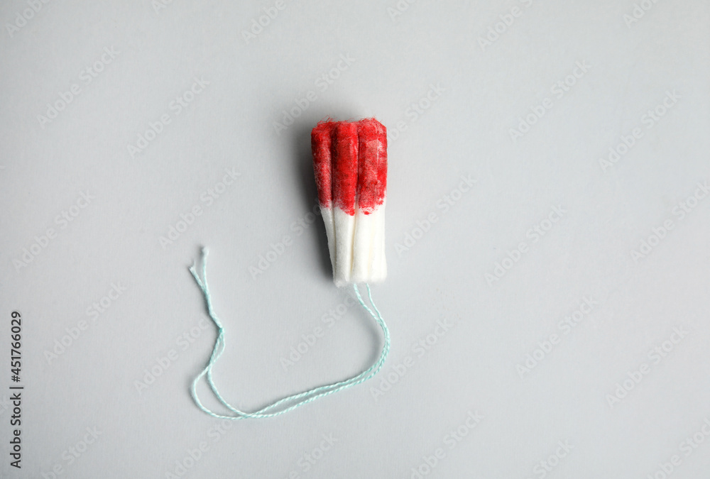 Used tampon on light grey background, top view Stock-Foto | Adobe Stock