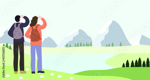 Landscape with mountains. Travelers look into the distance at the lake.