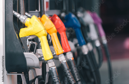 Bilde på lerret yellow red blue orange color fuel gasoline dispenser background, fuel pumps at a gas station