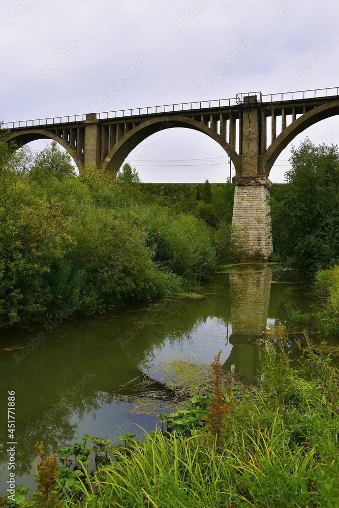 Fototapeta premium Old railway viaduct across the river