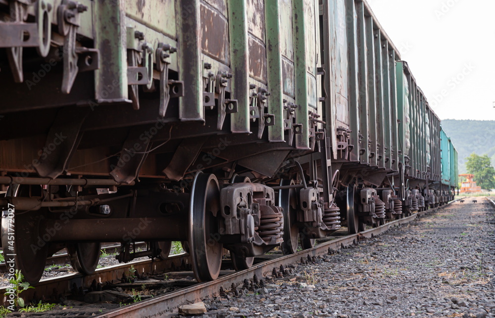 Old rusty railway cars stand on the tracks of the station Old rusty railway cars stand on the tracks of the station