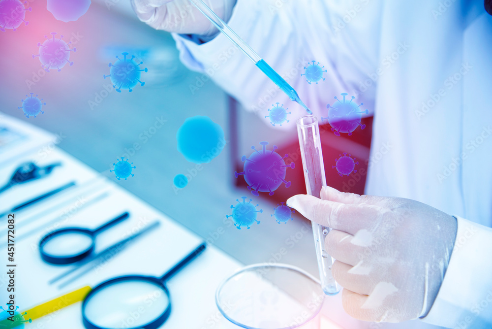 Scientists are preparing a test tube containing blue chemicals in a science lab to research an antiretroviral drug, the concept of care for the future of the world. Scientists are preparing a test tube containing blue chemicals in a science lab to research an antiretroviral drug, the concept of care for the future of the world.