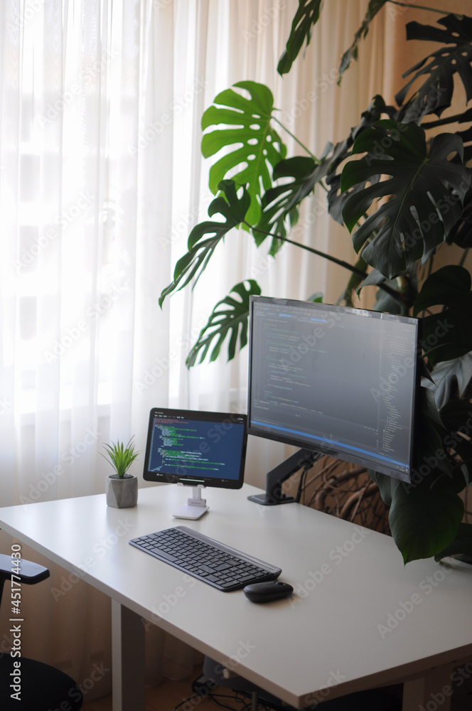 Fototapeta premium Work place for developer with curved screen and tablet.Comfort working from home
