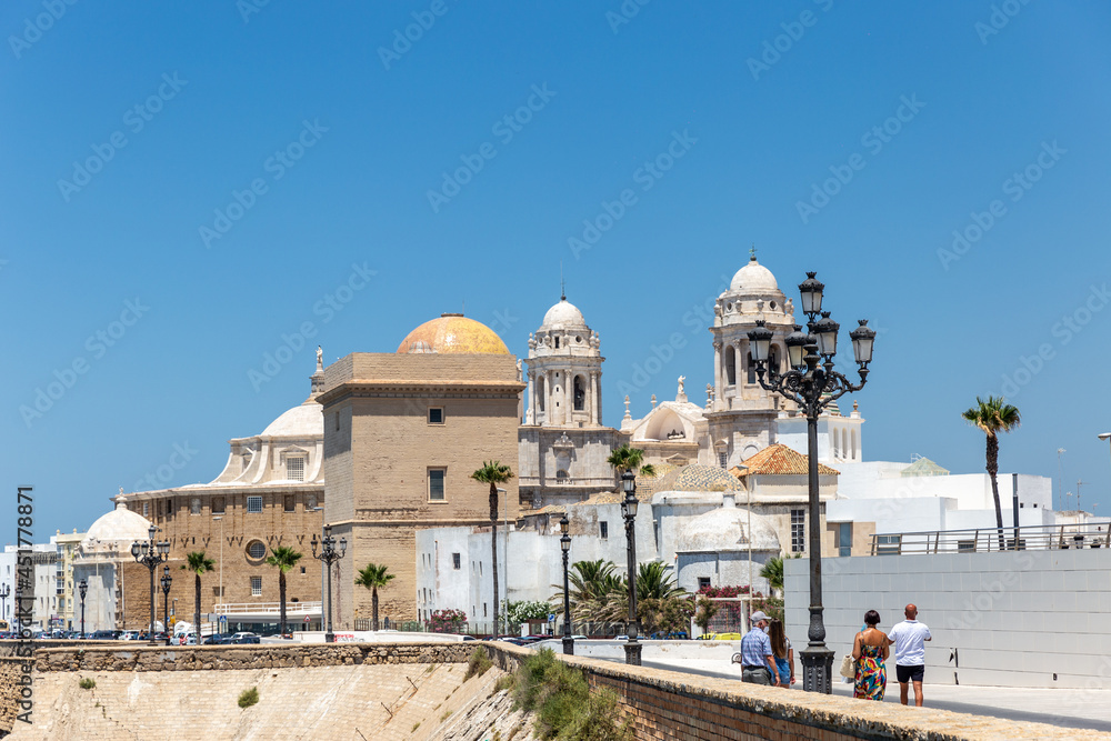 View of Cathedral Of Cadiz. Panoramic view of the city with promenade area and Mediterranean sea. Touristic travel destination in South of Spain. 
