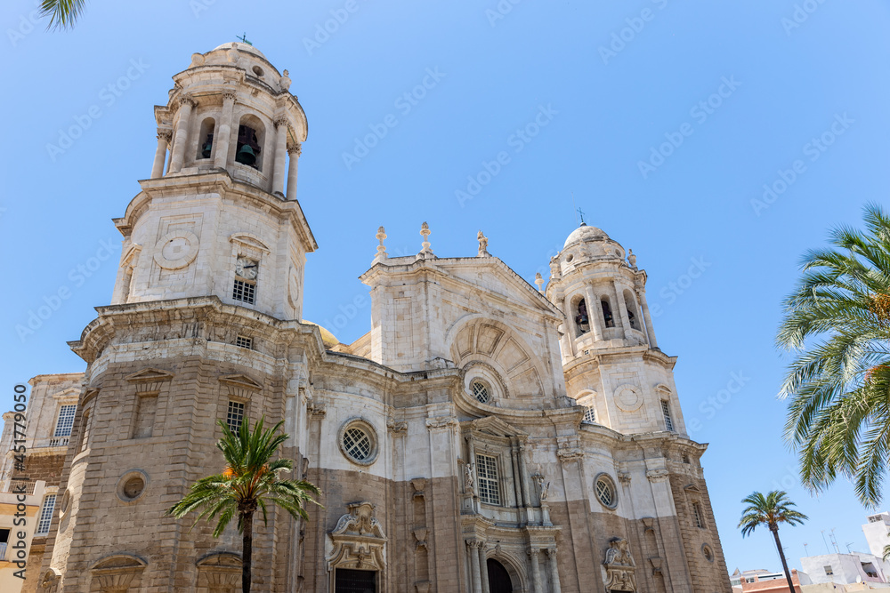 Façade of beautiful Cathedral of Cadiz, View of main entrance.  Roman Catholic church in Cádiz, southern Spain.  Architect Vicente Acero. Neoclassical style. 