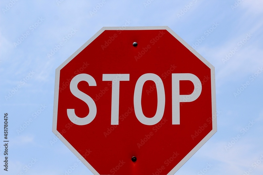 A close view of the red and white stop sign.