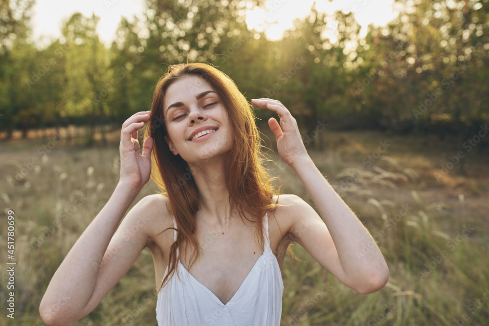 cheerful woman outdoors in a field walk fresh air summer